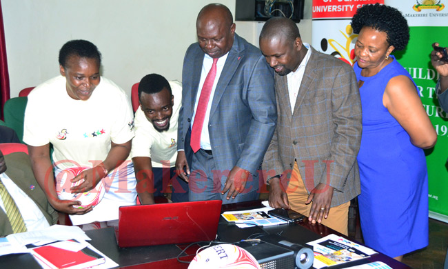 Hon Bakabulindi (Centre) launching the World University Netball Championship 2018 website